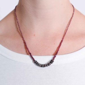 Short garnet strung necklace with silver forged links