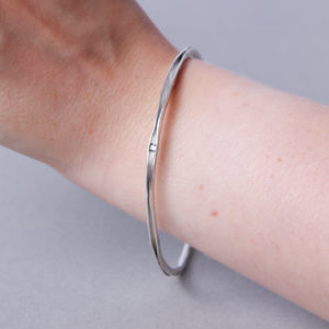 Slim silver forged bangle